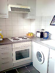 kitchen with washing machine in the apartment in Berlin Wilmersdorf 