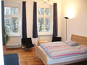 double bed in one of the bedrooms of the apartment