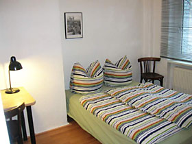 double bed in one of the bedrooms of the apartment
