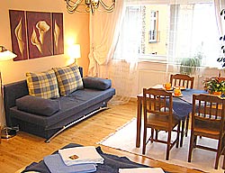 large room with double bed and sleeping sofa for 2 persons each, 1 extra guest-bed possible