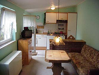 the kitchen  with seating corner