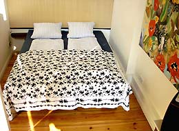large double bed in bed room of holiday apartment