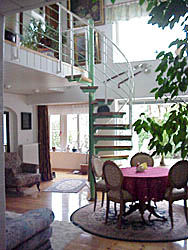 living room with bed-couch in holiday house