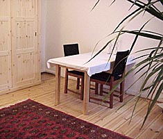 Dining table and big wardrobe in the holiday apartment in Sybelstraße