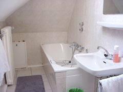 tiled bath with bath tub