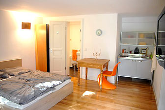 Views of the holiday apartment: double bed and kitchen - in Meerbusch-Büderich by Düsseldorf