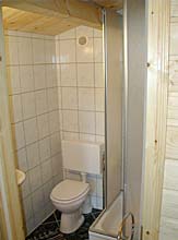 The bathroom with a shower and WC  in the  bungalow