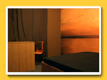 The guest room with king bed and a sitting area