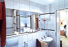 tiled bathroom with bathtub