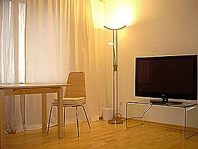 Living room  with TV in the holiday apartment in Munich