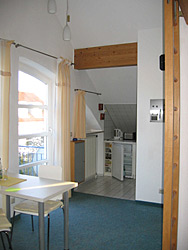 Dining table and view into the kitchen in Unterschleissheim