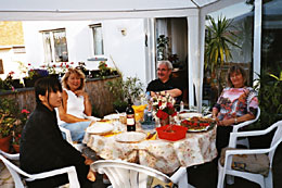 Chatting with guests on the terrace